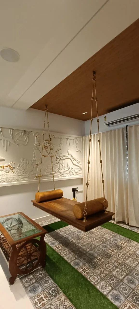 Decorative relief feature wall with a timber swing seat, curtains and pendant lights