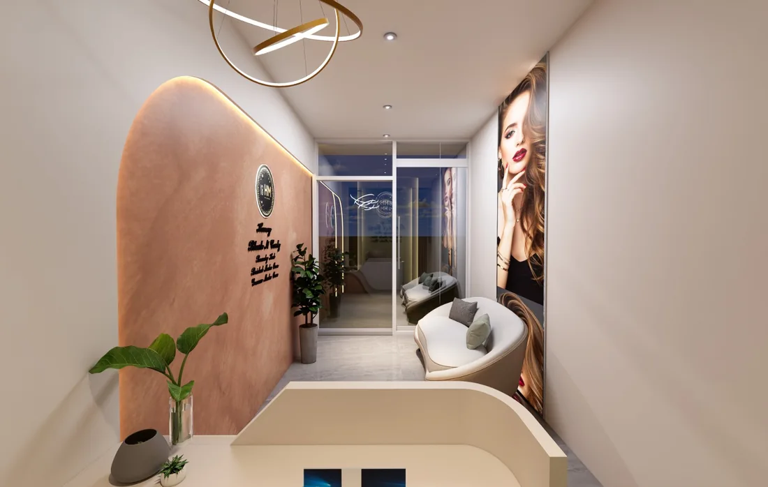 Salon waiting area with curved seating, a statement light and a reception desk